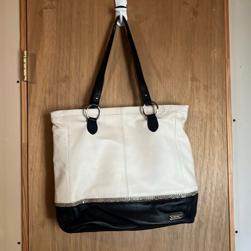 Woman’s The Sak cream & black leather purse bag